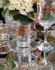 Bowl, Goblets , Cup and Saucer from Stemware Cristi collection transparent glass with brown and golden design