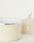 Opened Chocolate moon dome jar having golden crescent on a lead