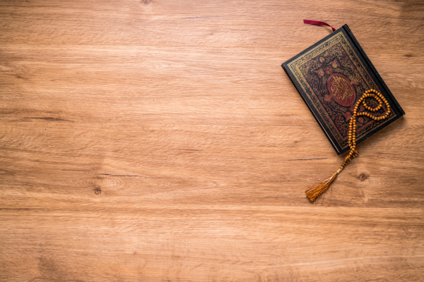 Leather bound Quran on a wooden surface