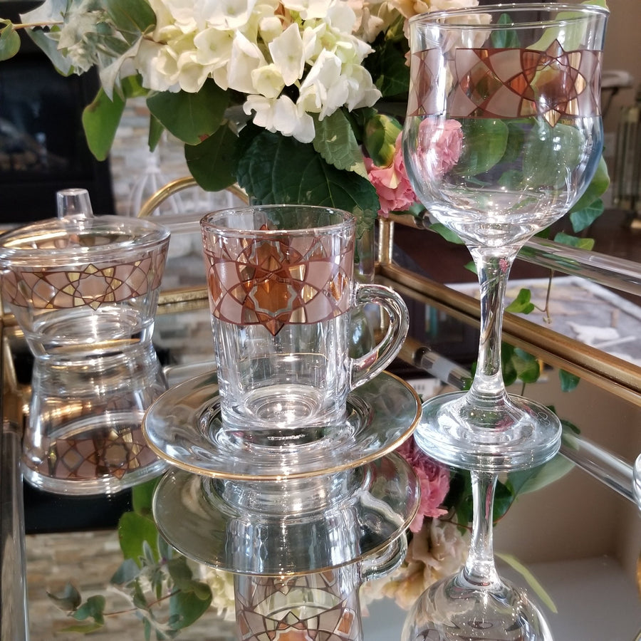 Bowl, Goblets , Cup and Saucer from Stemware Cristi collection transparent glass with brown and golden design