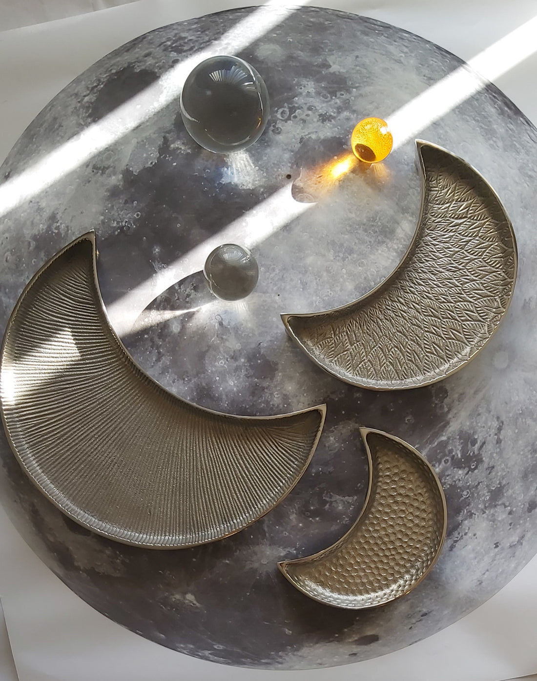 Silver Color Textured moonlight platter with all sizes Large, Medium, and Small placed on a round table