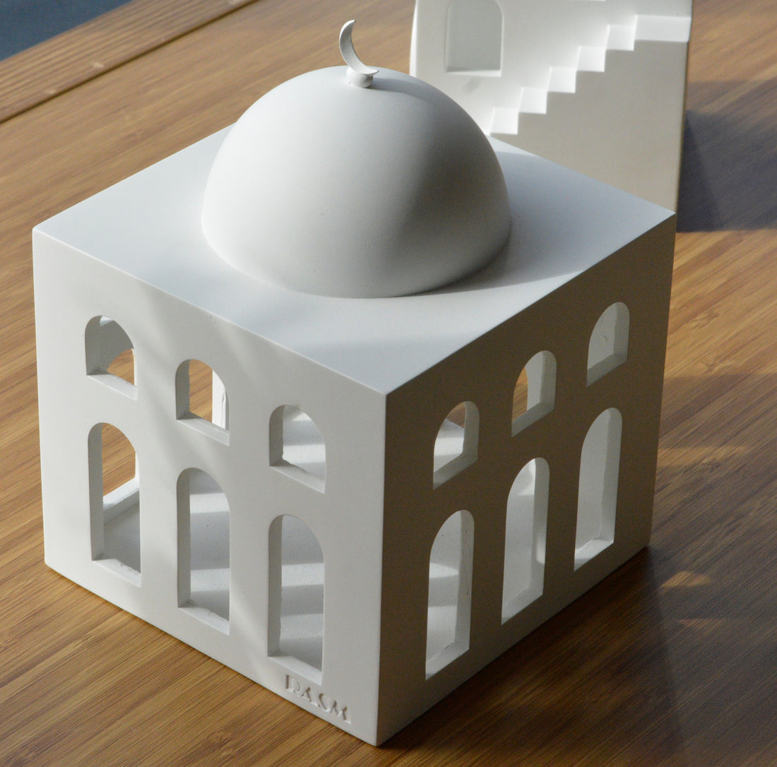 rasm mosque sculpture placed on table photo