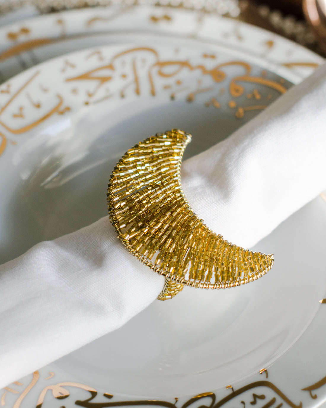 Golden napkin ring used to decor iftar table
