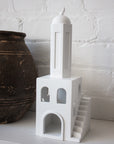 rasm minaret sculpture placed on table to decor home