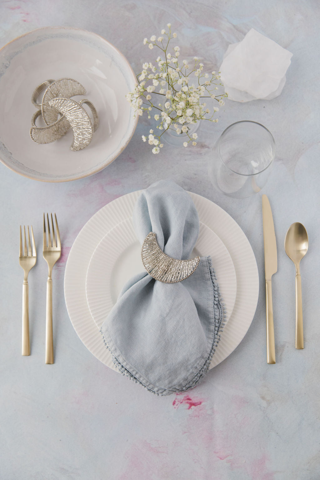 Sliver Beaded Moon Napkin Ring with napkin on dinner table set