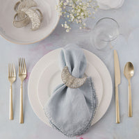 Sliver Beaded Moon Napkin Ring with napkin on dinner table set